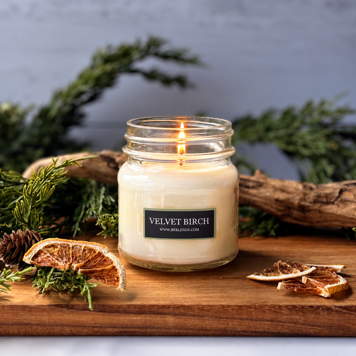 Velvet Birch soy candle by Be Blends with elegant mistletoe, cranberry, cypress, and orange fragrance notes.