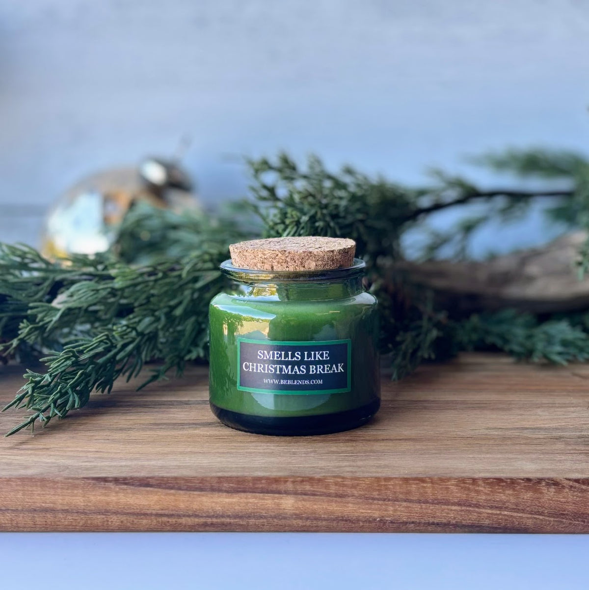 Smells Like Christmas Break 3 oz soy candle in a green jar with fresh Fraser Fir fragrance by Be Blends.